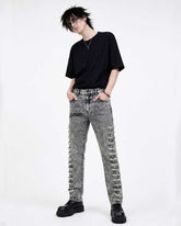 Men's distressed grey skinny denim jeans with ripped detailing and acid wash finish