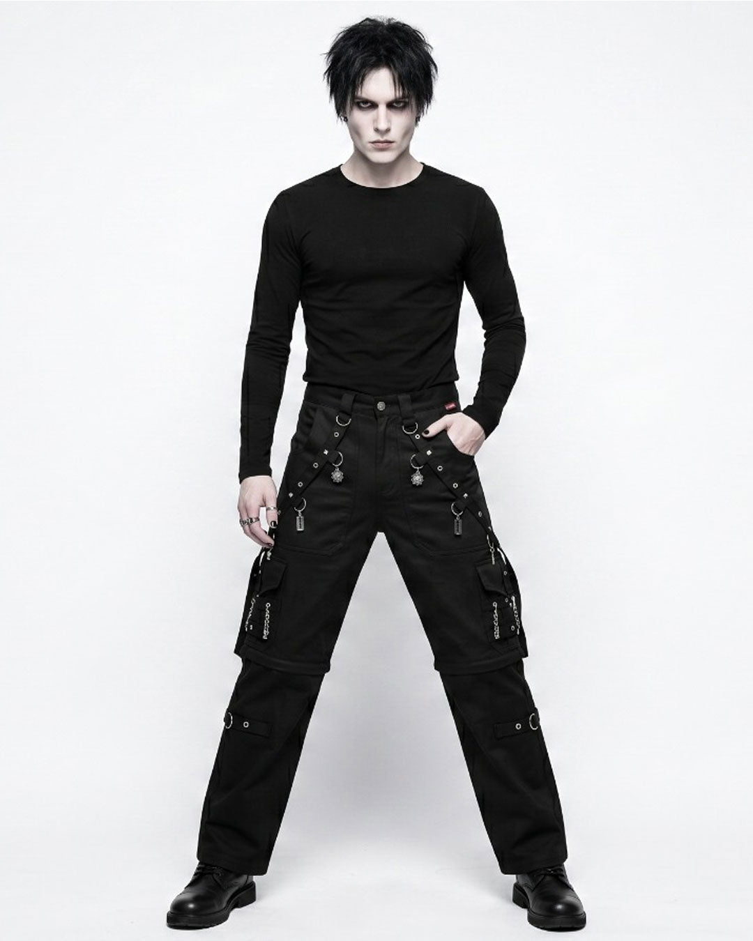 Men's black gothic cargo pants with spider web design, silver accents and utility pockets, front view
