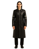 Black Gothic Cross long leather coat with silver cross embroidery on sleeves, button closure, and zippered pockets.
