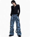 Men’s blue denim cargo pants with chains, buckles, distressed finish, and functional pockets for street style