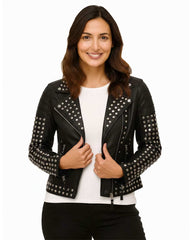 Woman wearing black studded leather jacket with silver-tone studs and asymmetrical zip closure