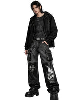 Gothic chain pants in black mixed denim and leather-look fabric with utility pockets, metal hardware, chain details, and bold front graphic artwork shown in front and back view.