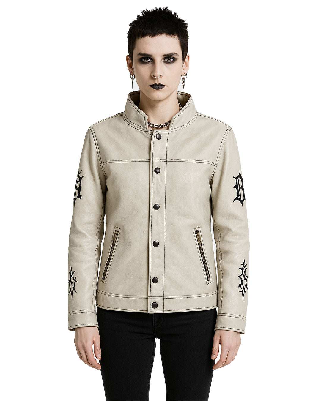 Gothic cream leather jacket with black embroidery on sleeves, snap-neck collar, button-front closure, and zippered pockets worn by model.