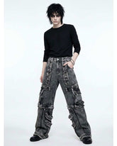 Distressed black denim cargo pants with oversized fit and multiple pockets in Y2K streetwear style