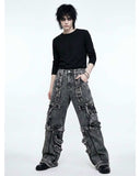 Distressed black denim cargo pants with oversized fit and multiple pockets in Y2K streetwear style