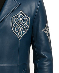 Close-up of men’s blue gothic leather coat with intricate silver embroidery on sleeve and chest