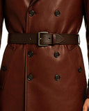 Close-up of maroon gothic leather trench coat with double-breasted buttons and adjustable belt