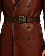 Close-up of maroon gothic leather trench coat with double-breasted buttons and adjustable belt