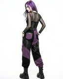 Person wearing a black and purple outfit with a sheer top on a white background
