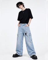 Men's light blue graphic baggy jeans with bold dark artwork and wide-leg Y2K fit, front view
