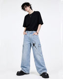 Men's light blue graphic baggy jeans with bold dark artwork and wide-leg Y2K fit, front view