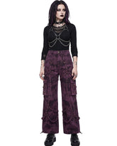Woman wearing purple cargo pants, emo pants, cargo pants women's pants front view with harness top