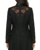 Back view of women’s black steampunk coat with pumpkin embroidery and long tailcoat hem