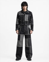 Men’s double denim outfit set with black and grey patchwork jacket and baggy wide-leg jeans front view