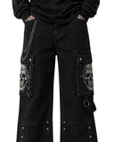 Close-up of baggy men black jeans cargo pockets with skull design and chain detailing