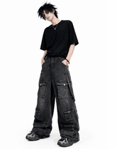 Black baggy cargo jeans for men with oversized fit, washed black denim look, and multiple utility flap pockets in streetwear style.