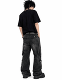 Black baggy cargo jeans for men with oversized fit, washed black denim look, and multiple utility flap pockets in streetwear style.