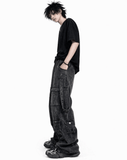 Black baggy cargo jeans for men with oversized fit, washed black denim look, and multiple utility flap pockets in streetwear style.