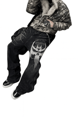 Unisex Gothic Skull jeans in vintage washed black denim with large white skull embroidery and relaxed wide-leg fit