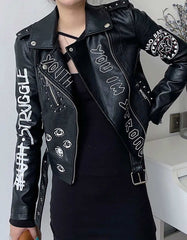 Women's black graphic leather biker jacket with white and red prints, asymmetrical zipper, and belted waist