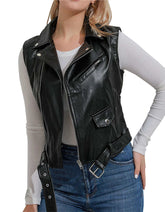 Women's black moto leather vest with zipper and adjustable straps, styled over long sleeve shirt and jeans