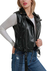 Women's Black moto leather vest with zippered front and adjustable straps, styled over white long sleeve top and blue jeans