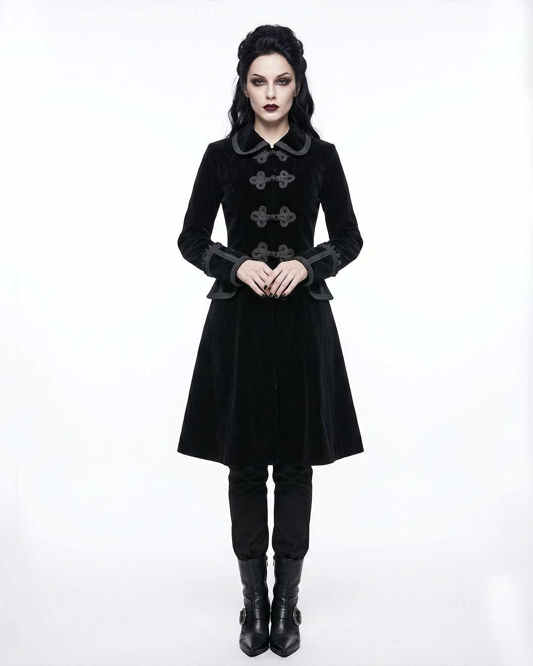 Women wearing elegant black velvet gothic coat with Victorian design and ornate buttons