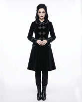 Women wearing elegant black velvet gothic coat with Victorian design and ornate buttons