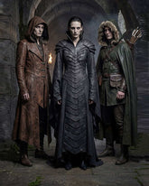 Dark fantasy Dragon-Scale Magus Leather Coat with layered dragon-scale chest design, high wizard collar, armored shoulders, and flowing cloak style.