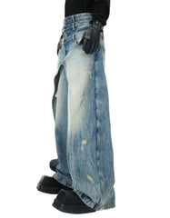 Layered distressed blue jeans with wide-leg fit and edgy streetwear style