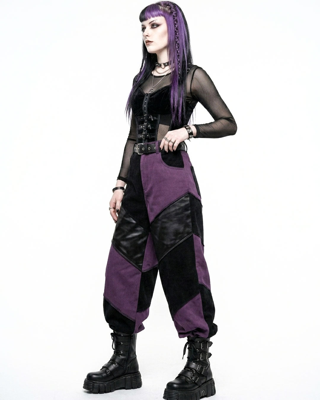 Person wearing a gothic-style outfit with purple and black colors on a white background