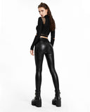 Skinny black leather pants for women styled with platform boots, full gothic look