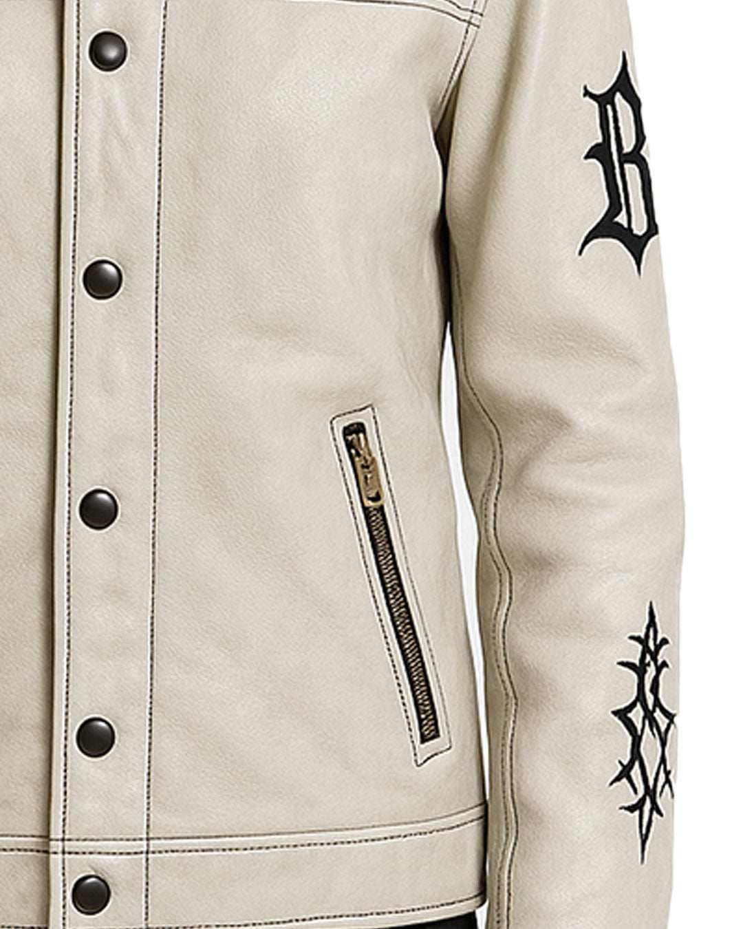 Close-up of Gothic cream leather jacket with black embroidered sleeve, snap-neck collar, button-front closure, and zippered pocket