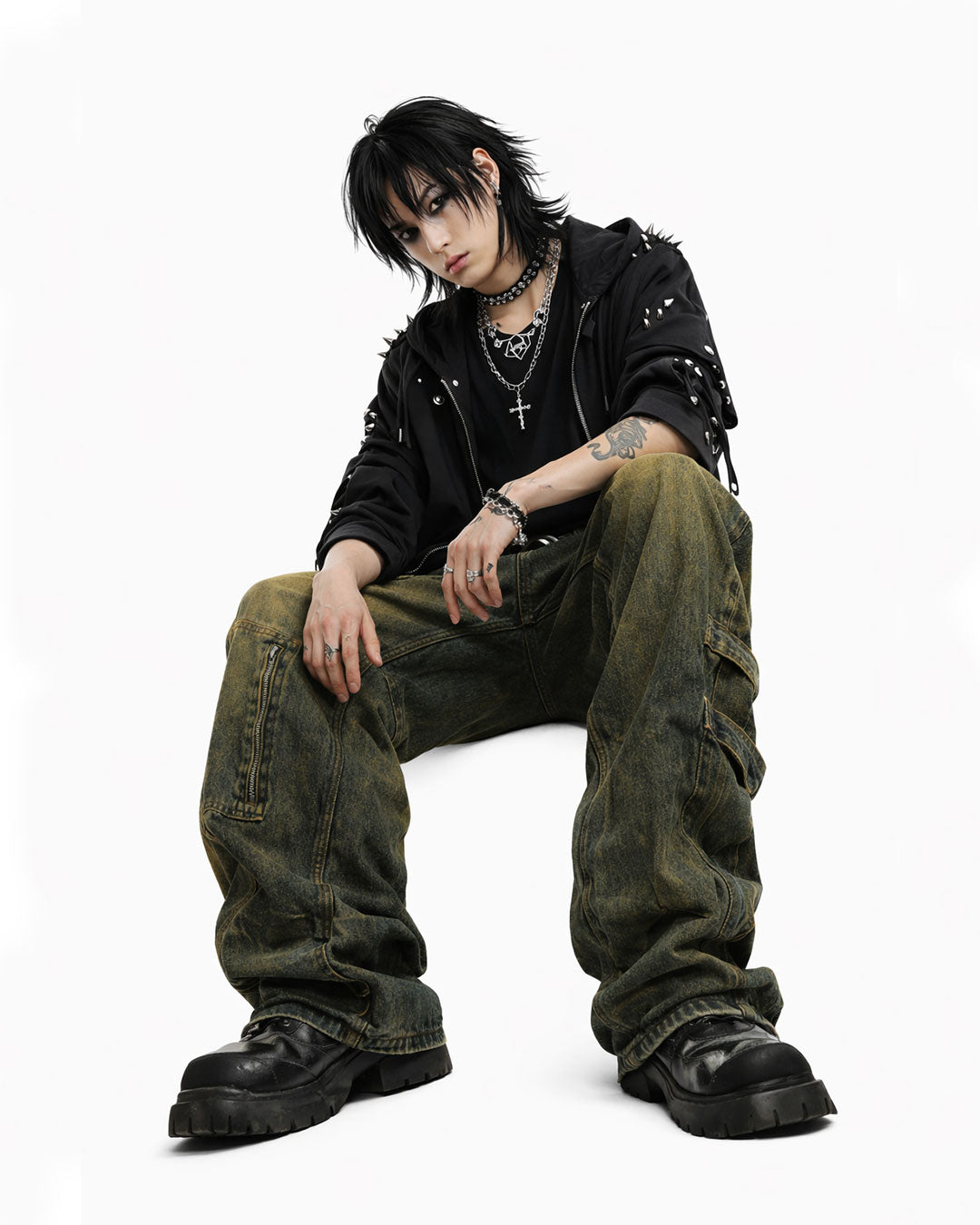 Mens baggy cargo jeans in washed dark denim with wide-leg fit, utility straps, curved seam panels, and streetwear styling shown in product and model view.