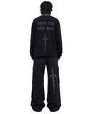 Back view of baggy jeans men with gothic cross graphic print