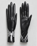A pair of black leather gloves shown flat against a light gray background, featuring a white spider emblem and white diagonal stripe details near the cuffs.