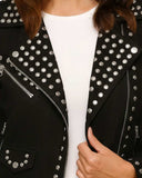 Black studded suede leather biker jacket with metal studs and asymmetrical zipper on white top
