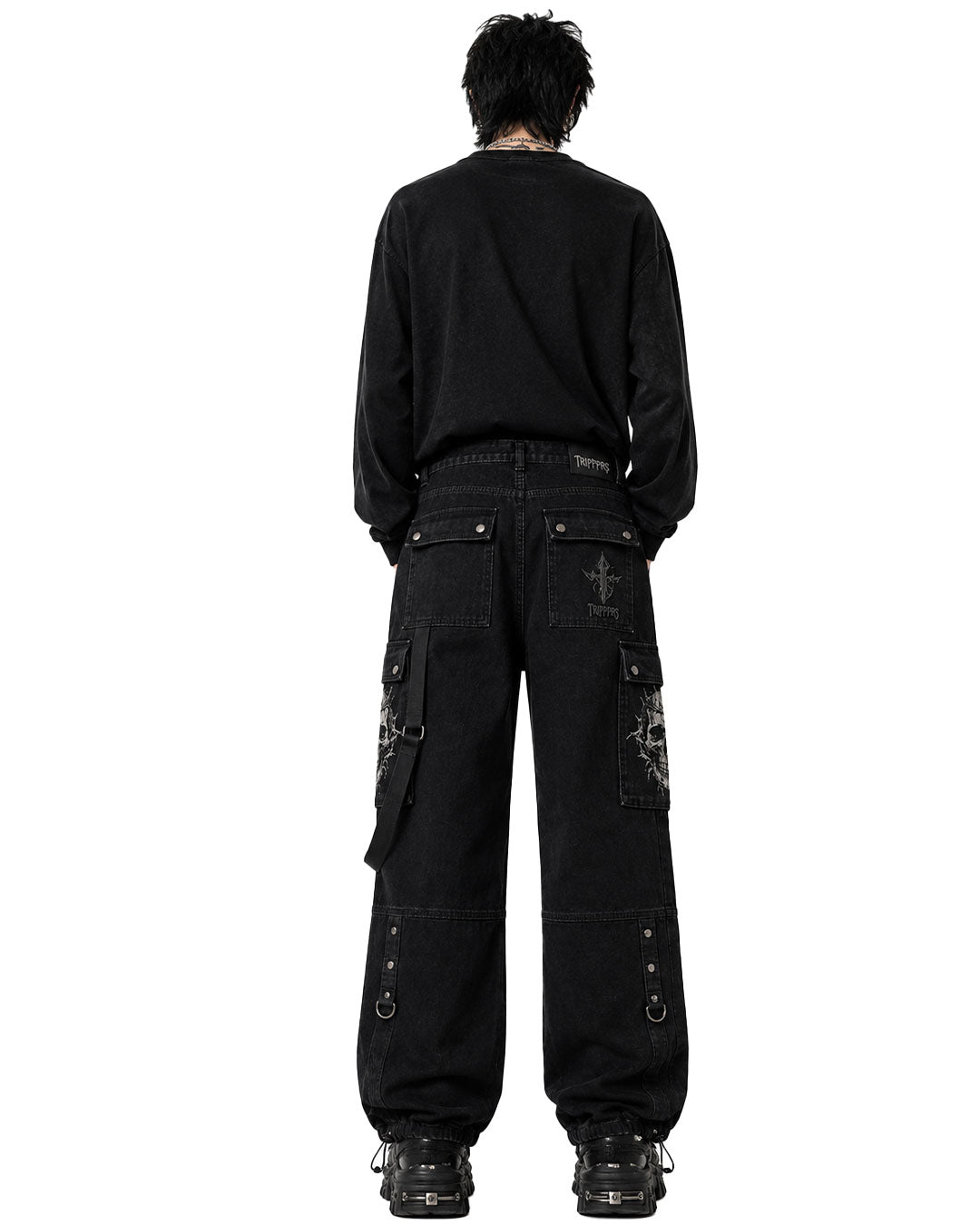Baggy men black jeans styled with oversized sweatshirt, back view showing patch pockets