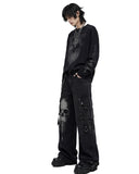 Side view of wide leg cargo pants showing oversized silhouette and skull design