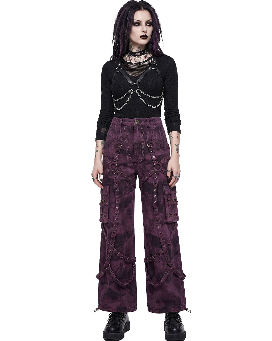 Woman wearing purple cargo pants, emo pants, cargo pants women's pants front view with harness top