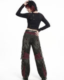 Back view of women's baggy cargo pants with oversized cargo pockets, gothic patchwork panels, and relaxed wide-leg fit.