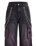 Close-up of chain detail and spiderweb embroidered pocket on cargo pants