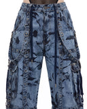 Closeup of wide leg cargo jeans pockets, baggy cargo pants women hardware detail, denim straps and D-rings