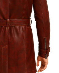 Close-up of back and sleeve details on maroon leather trench coat with belt and zipper cuff