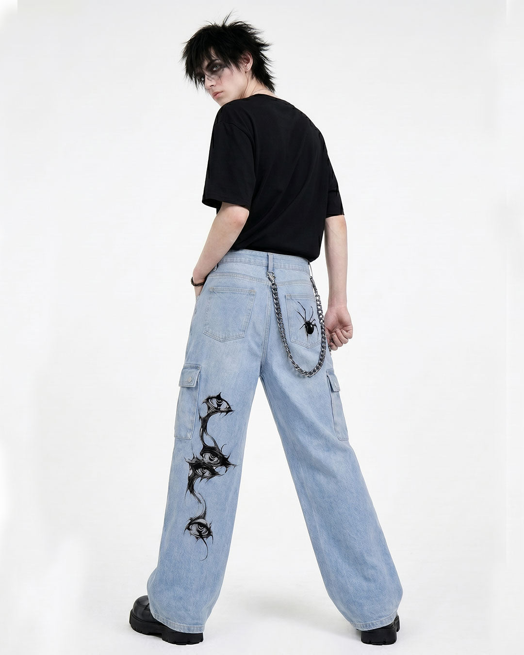 Close-up of graphic detailing on men's Y2K baggy denim jeans