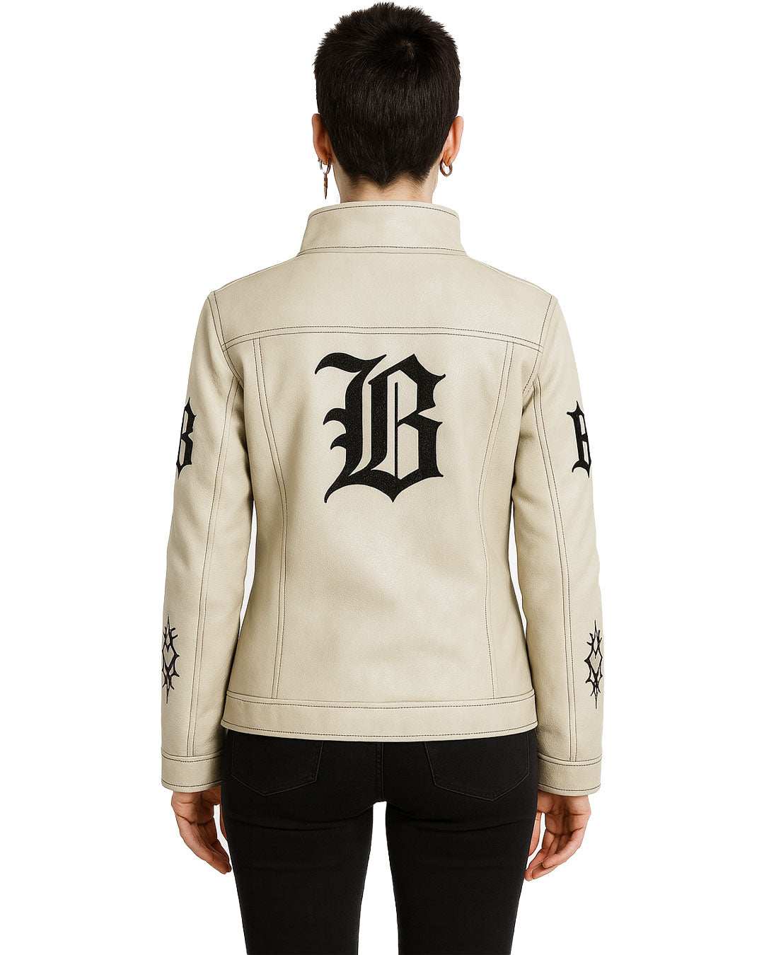 Back view of Gothic Cream Leather Jacket with black gothic embroidery on sleeves and back, worn with black pants