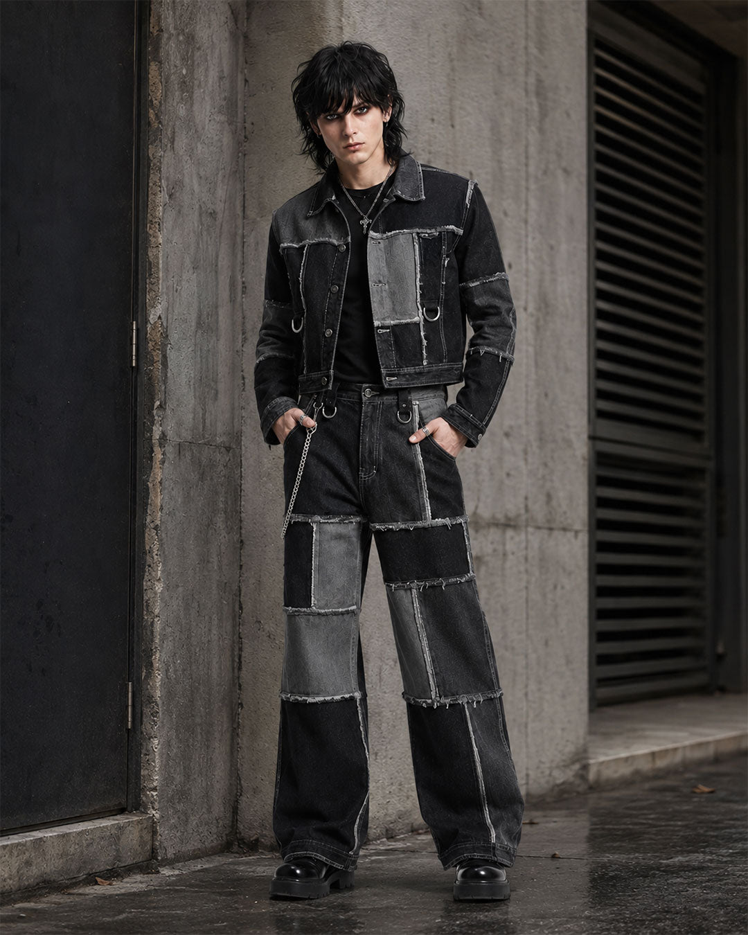 Men’s double denim outfit set with black and grey patchwork jacket and baggy wide-leg jeans front view