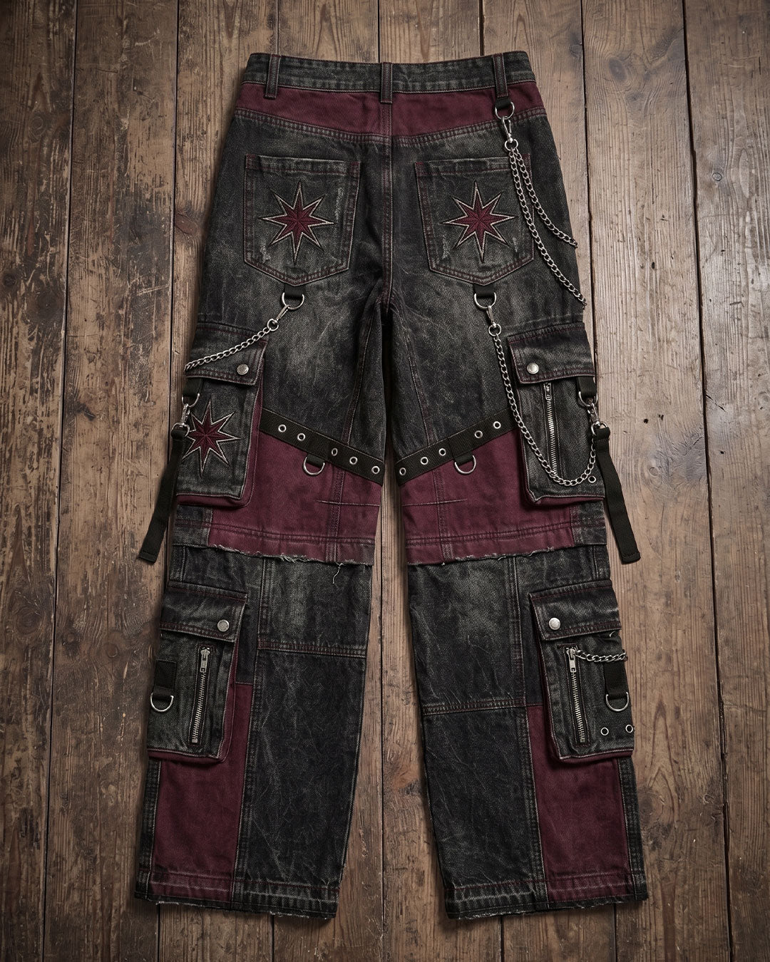 Back view of women's cargo jeans with baggy cargo pants silhouette, functional cargo pockets, and gothic patchwork design on washed denim.