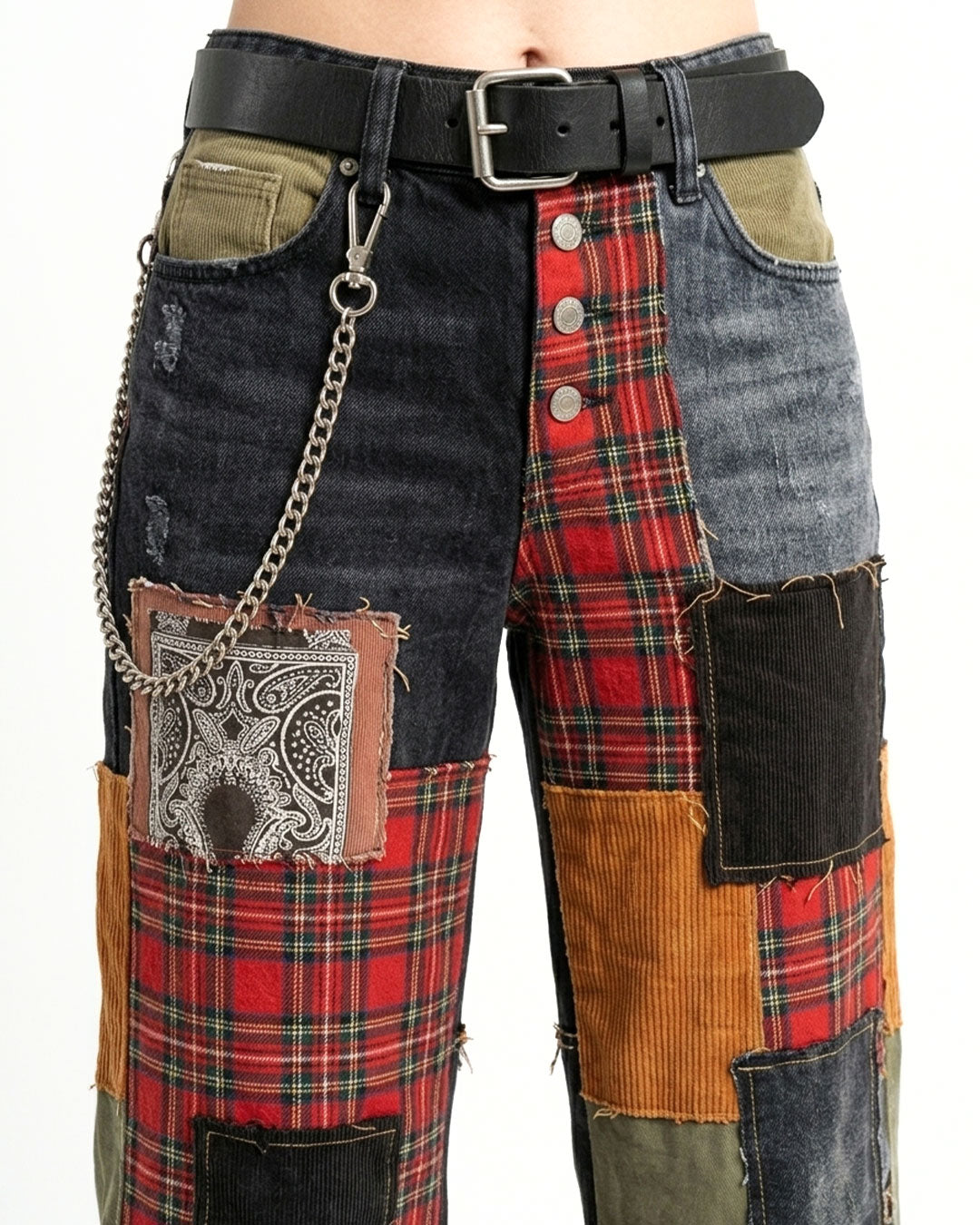 Patchwork pants with plaid and denim patterns on a white background