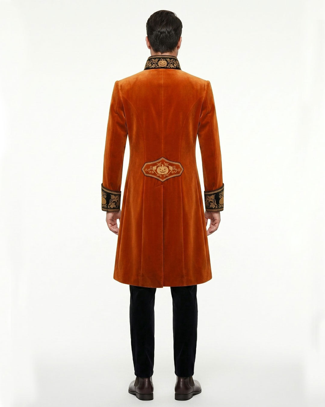 Mens orange coat with black and gold embroidered lapel, cuffs, and long Victorian gothic tailcoat design shown on male model